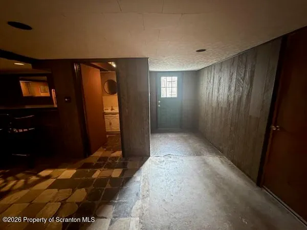 a view of a house with a wooden deck