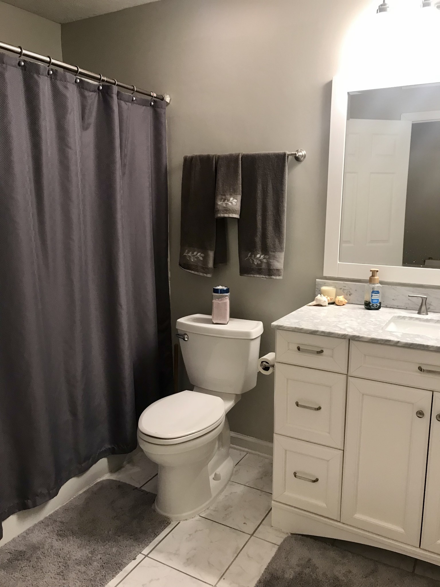 7050 Williams Road Cross Plains, TN 37049 - Photo 25 of 50 a bathroom with a granite countertop sink toilet mirror and shower