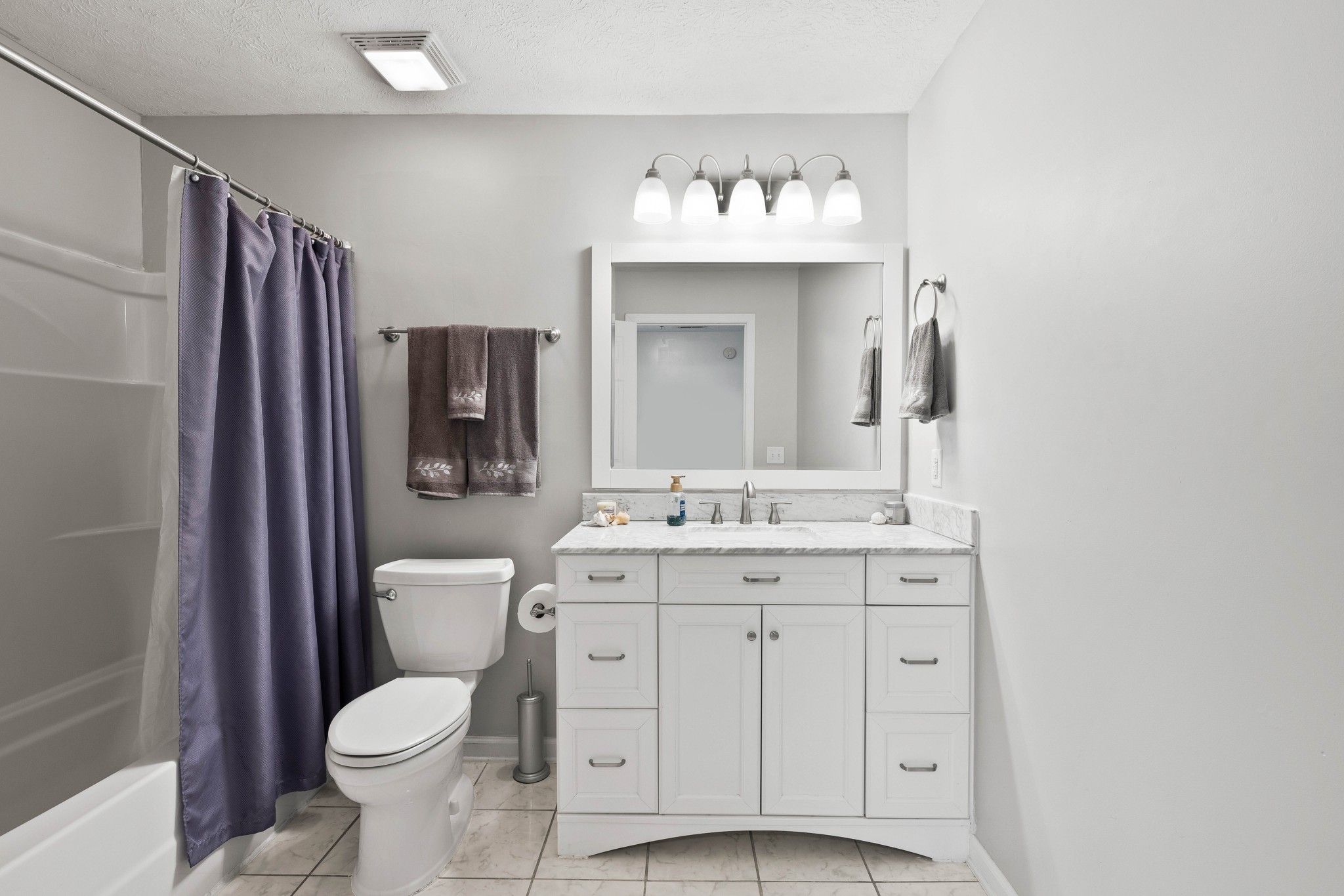7050 Williams Road Cross Plains, TN 37049 - Photo 33 of 50 a bathroom with a toilet sink and mirror