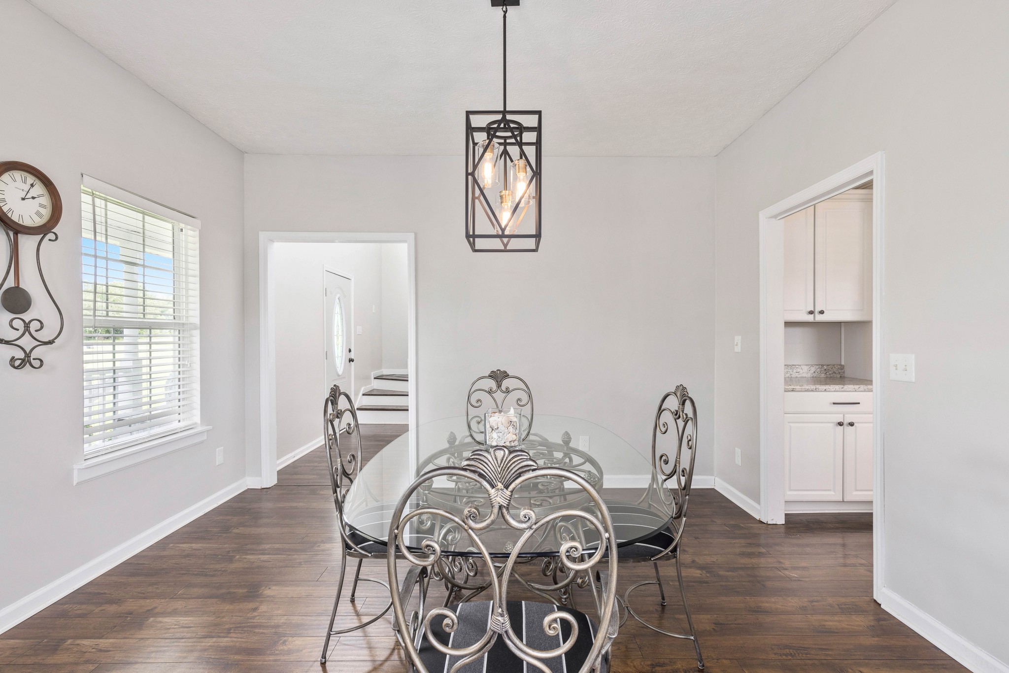 7050 Williams Road Cross Plains, TN 37049 - Photo 40 of 50 a view of a dining room with furniture window and wooden floor