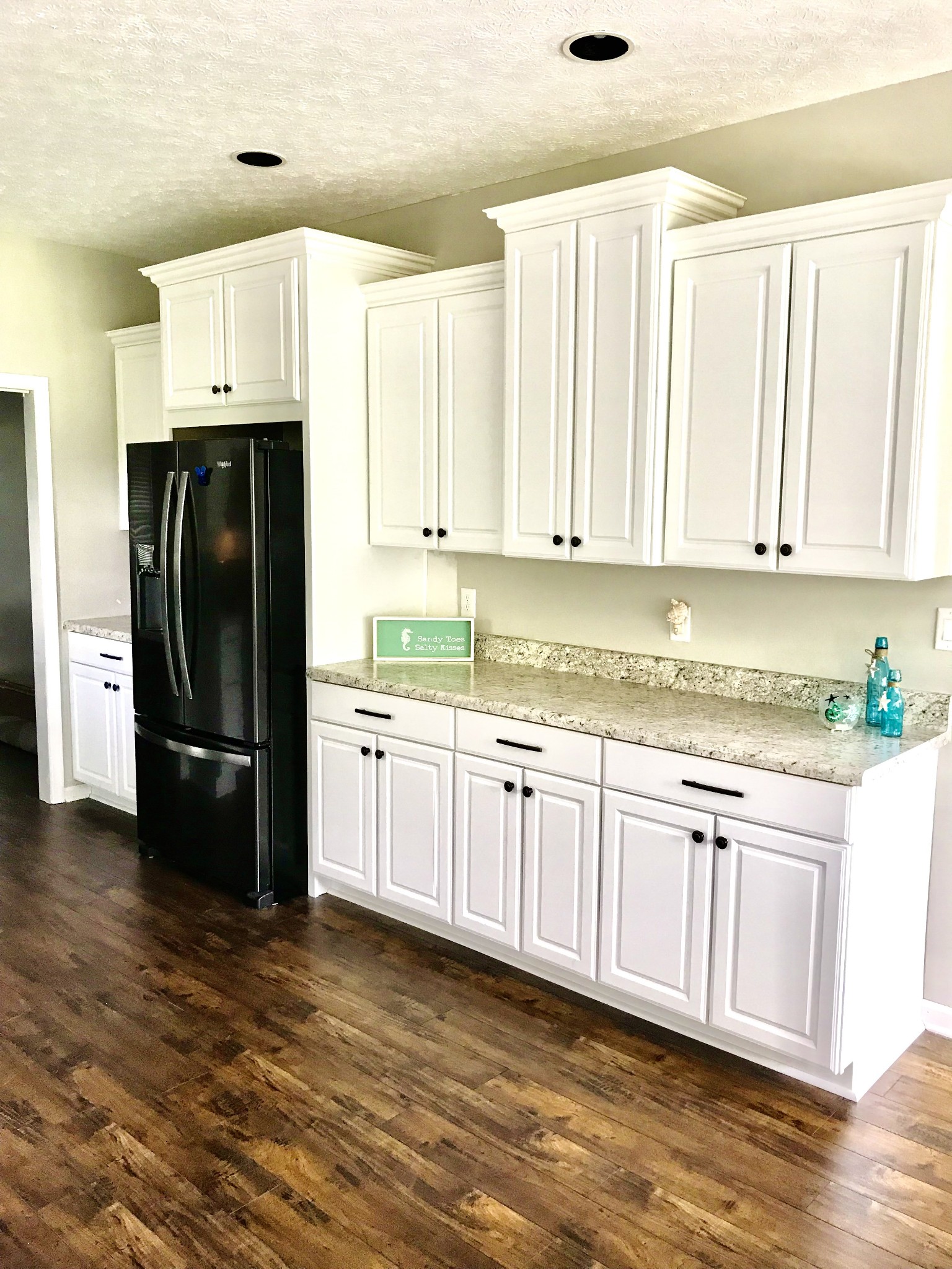 7050 Williams Road Cross Plains, TN 37049 - Photo 6 of 50 a kitchen with granite countertop a refrigerator sink and cabinets