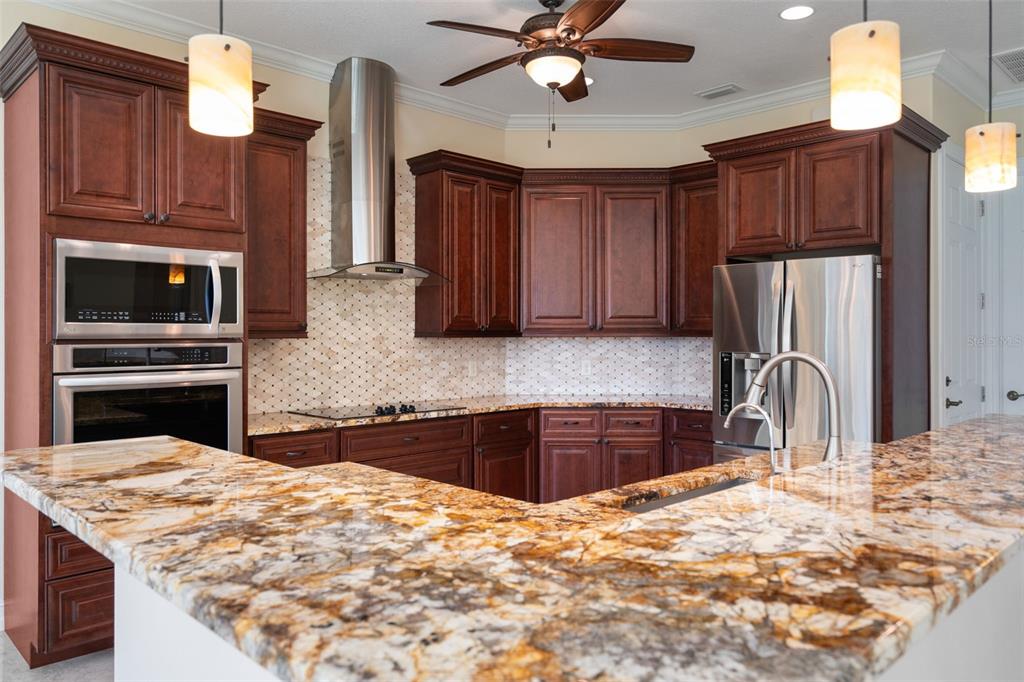 1900 Colleen Street Sarasota, FL 34231 - Photo 13 of 49 a kitchen with stainless steel appliances granite countertop a sink refrigerator and cabinets