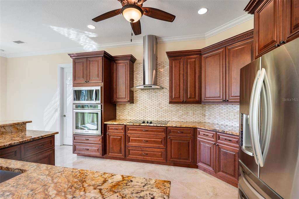 1900 Colleen Street Sarasota, FL 34231 - Photo 15 of 49 a kitchen with stainless steel appliances granite countertop a refrigerator and a sink