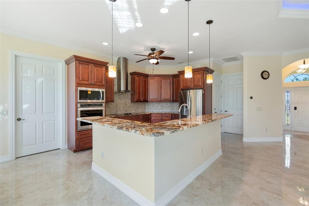 1900 Colleen Street Sarasota, FL 34231 - Photo 17 of 49 a kitchen with stainless steel appliances granite countertop a stove and a refrigerator