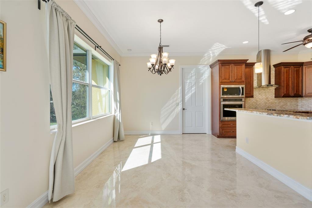 1900 Colleen Street Sarasota, FL 34231 - Photo 18 of 49 a view of a kitchen with a sink and dishwasher a refrigerator with wooden floor