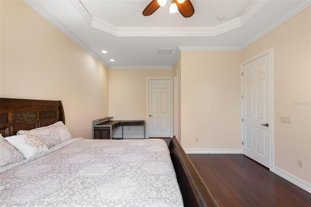 1900 Colleen Street Sarasota, FL 34231 - Photo 23 of 49 a bedroom with a bed and a dresser