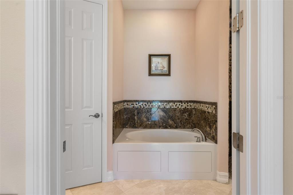 1900 Colleen Street Sarasota, FL 34231 - Photo 25 of 49 a white bath tub sitting next to a white wall