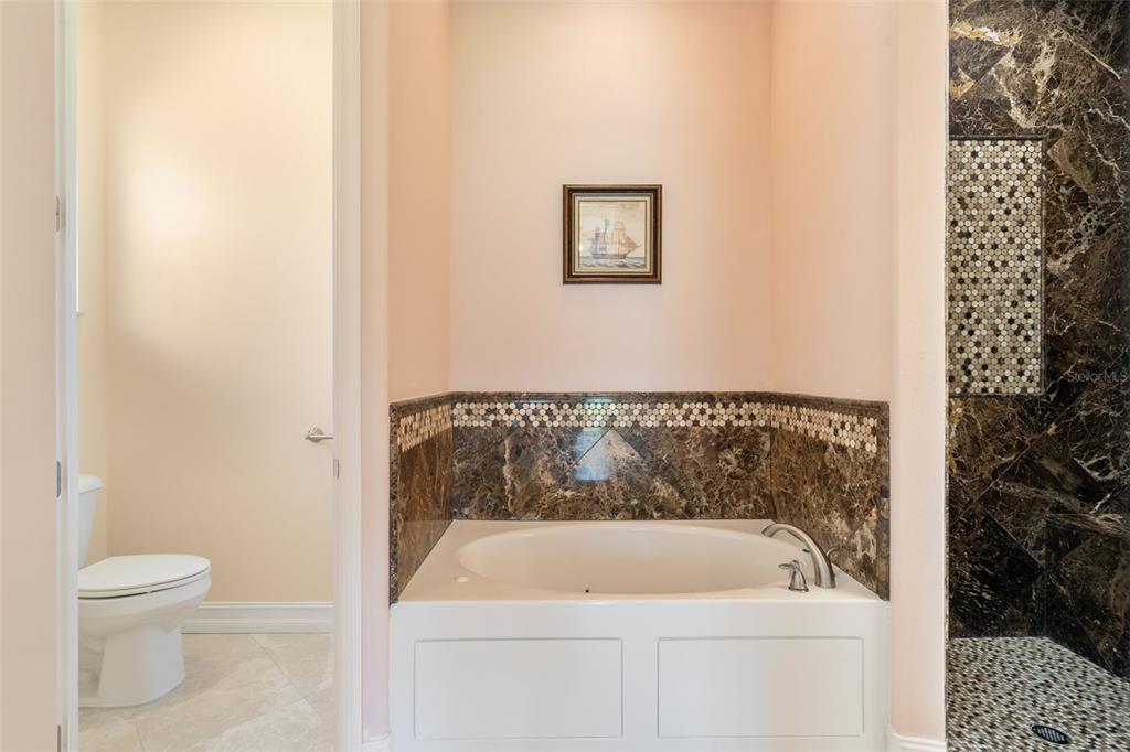 1900 Colleen Street Sarasota, FL 34231 - Photo 26 of 49 a bathroom with a bathtub and toilet
