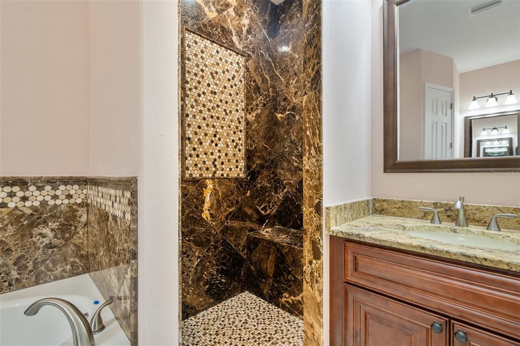 1900 Colleen Street Sarasota, FL 34231 - Photo 28 of 49 a bathroom with a sink and a mirror