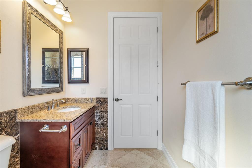 1900 Colleen Street Sarasota, FL 34231 - Photo 33 of 49 a bathroom with a sink and a mirror