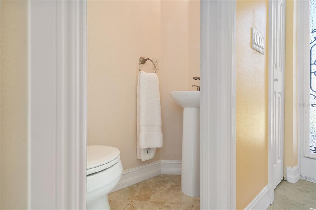 1900 Colleen Street Sarasota, FL 34231 - Photo 42 of 49 a bathroom with a granite countertop toilet and a shower