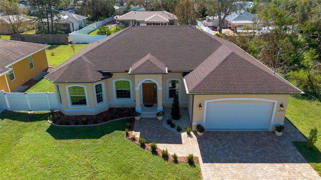 1900 Colleen Street Sarasota, FL 34231 - Photo 48 of 49 a aerial view of a house with table and chairs under an umbrella