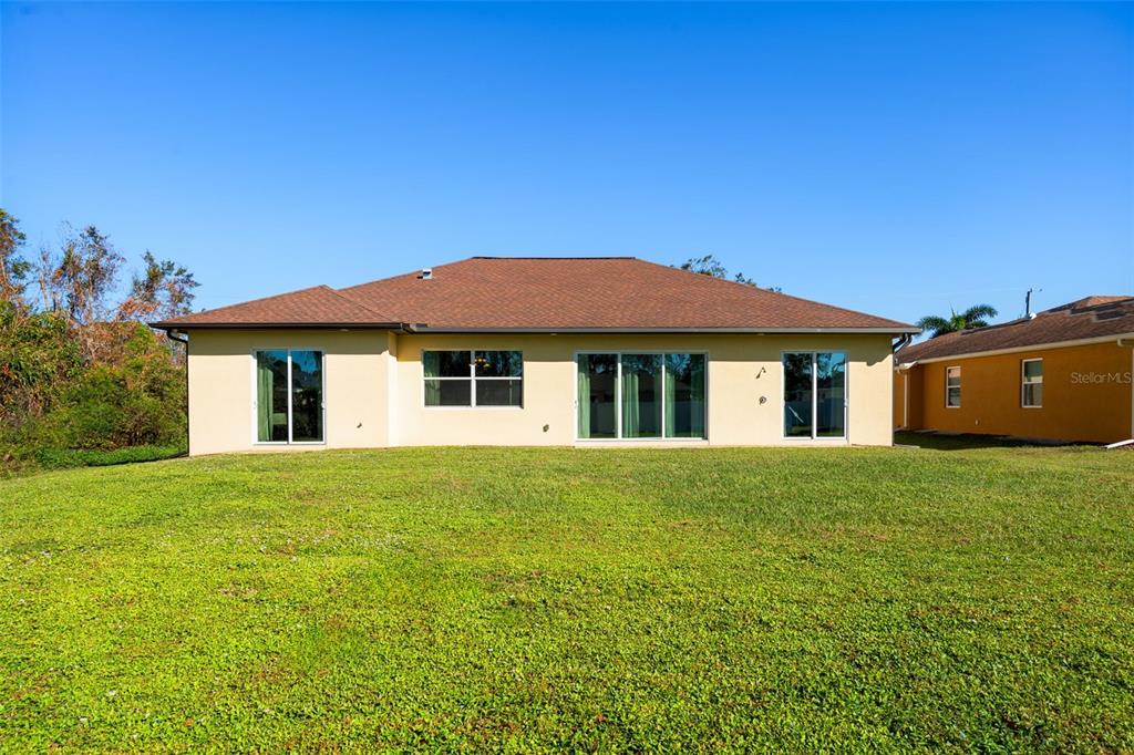 1900 Colleen Street Sarasota, FL 34231 - Photo 49 of 49 a front view of a house with a garden