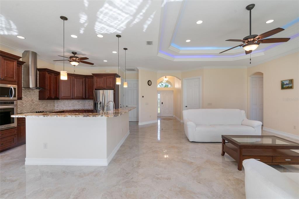 1900 Colleen Street Sarasota, FL 34231 - Photo 10 of 49 a living room with kitchen island furniture and a chandelier