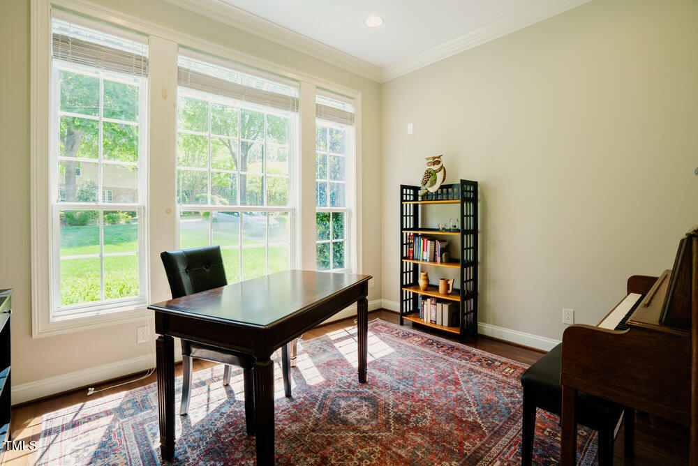 3911 Morvan Way Raleigh, NC 27612 - Photo 8 of 68 a view of a workspace with furniture and a window