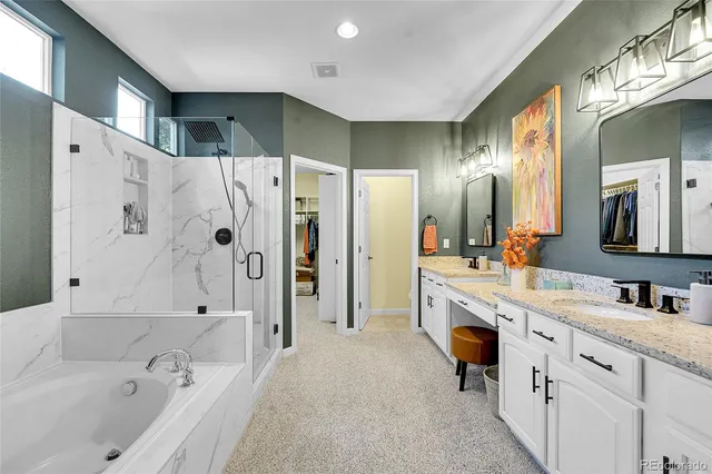 a bathroom with a tub sink double and mirror