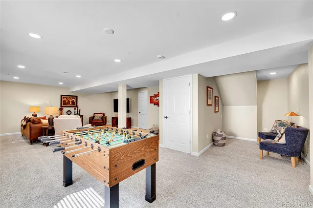 a bedroom with a bed potted plant and a window