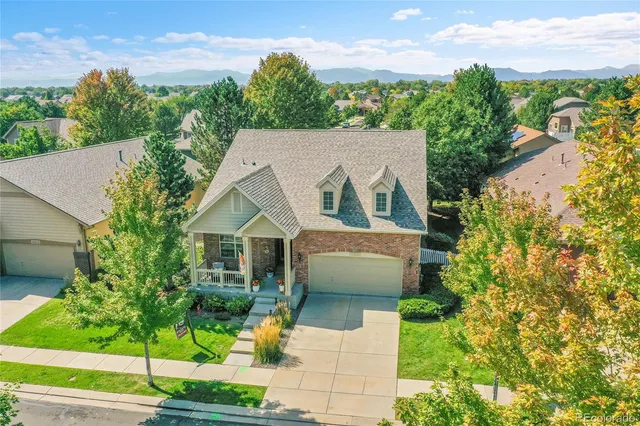 a front view of a house with outdoor seating
