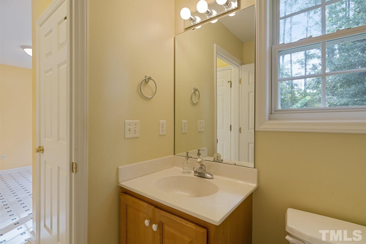 710 Windcrest Road Durham, NC 27713 - Photo 15 of 30 a bathroom with a sink a toilet and shower
