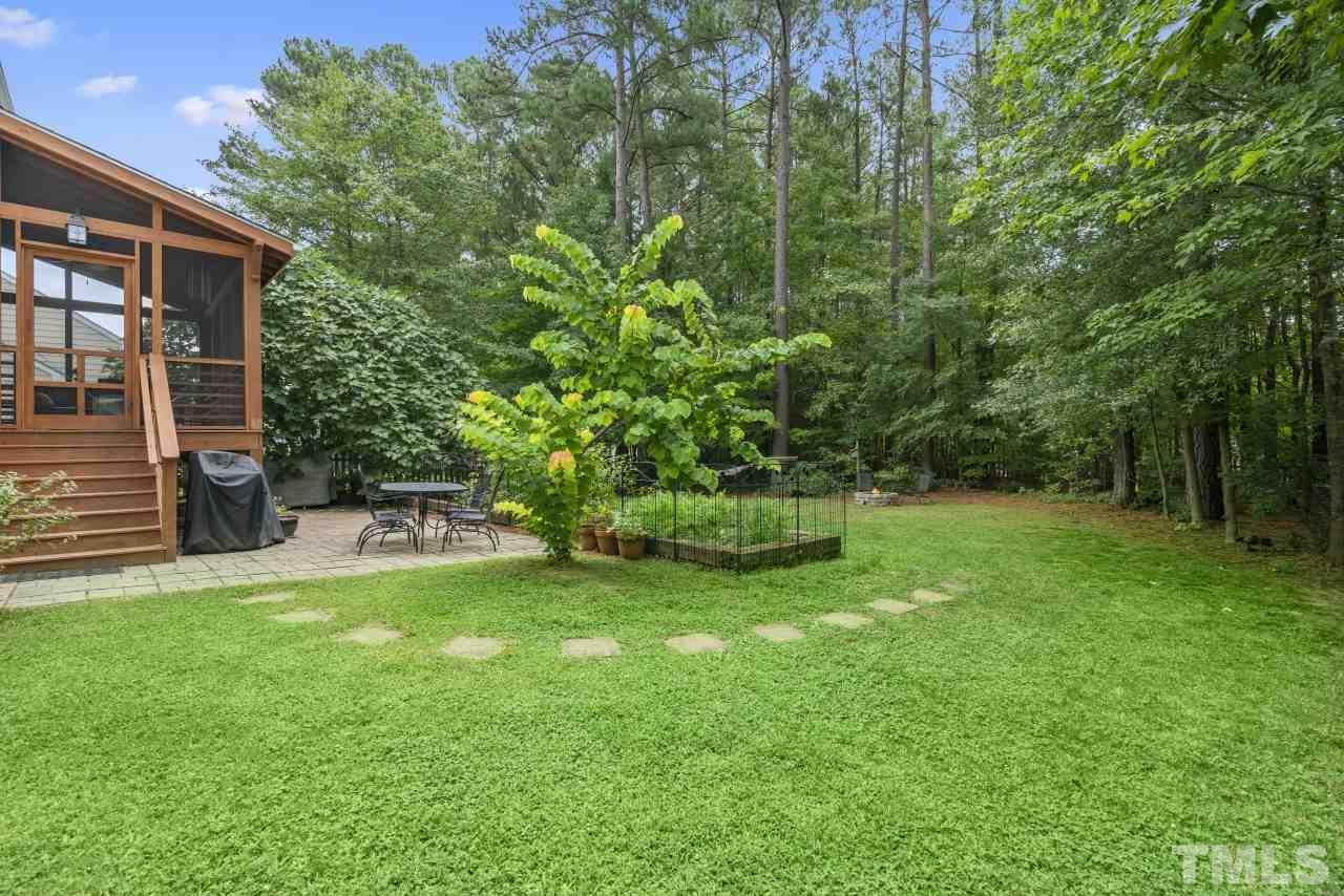 710 Windcrest Road Durham, NC 27713 - Photo 27 of 30 a view of a backyard with a garden