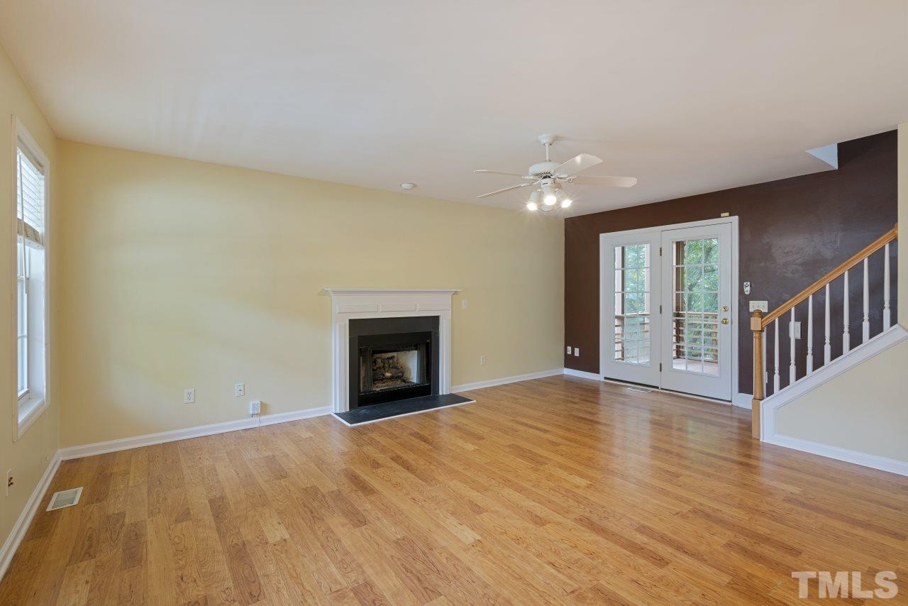 710 Windcrest Road Durham, NC 27713 - Photo 5 of 30 a view of an empty room with glass door and a window
