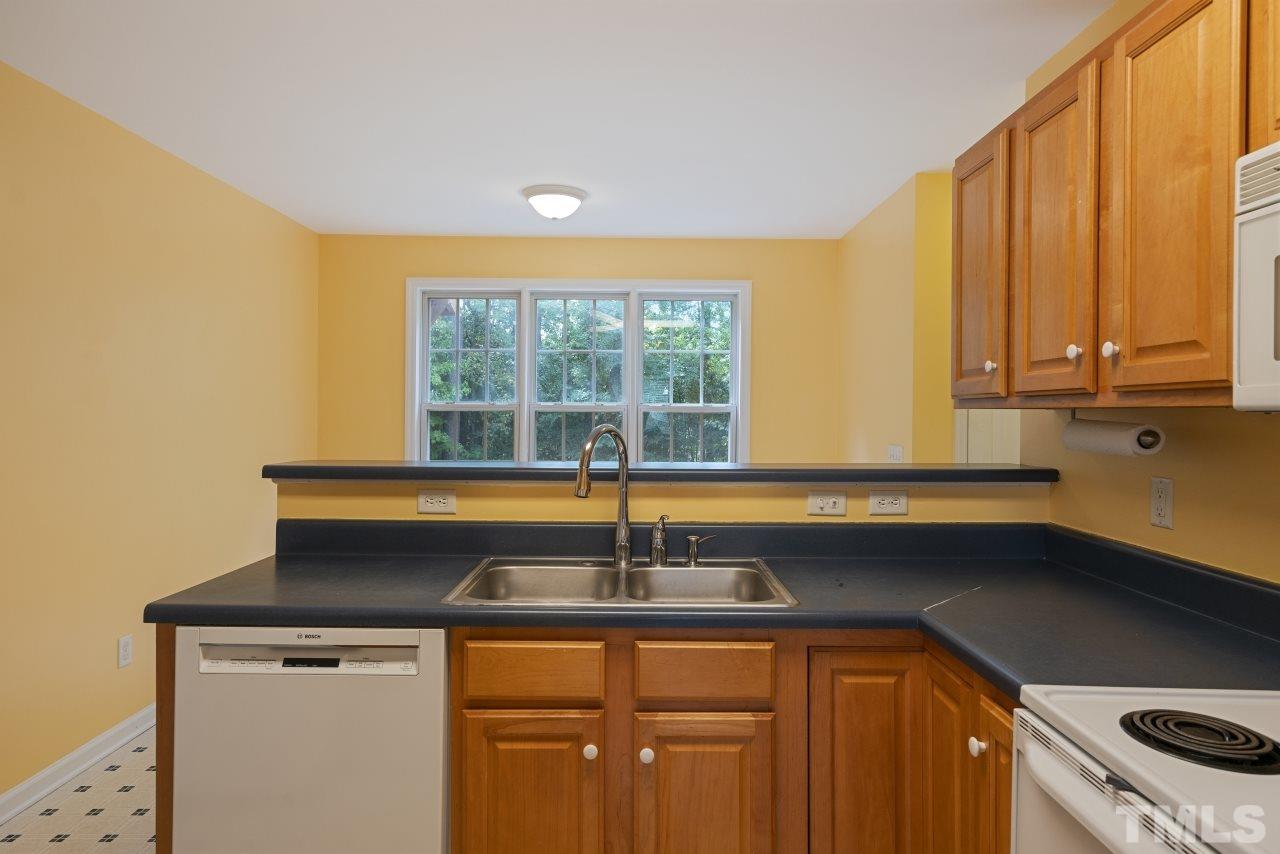 710 Windcrest Road Durham, NC 27713 - Photo 8 of 30 a kitchen with a sink and a window
