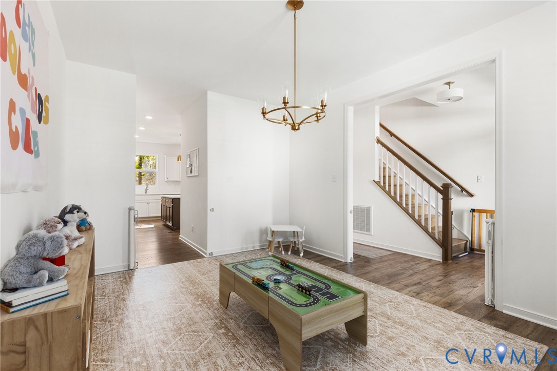 10001 Craftsbury Drive Midlothian, VA 23112 - Photo 12 of 32 a living room with furniture and a dining table