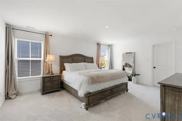 a bedroom with a bed and a cabinets