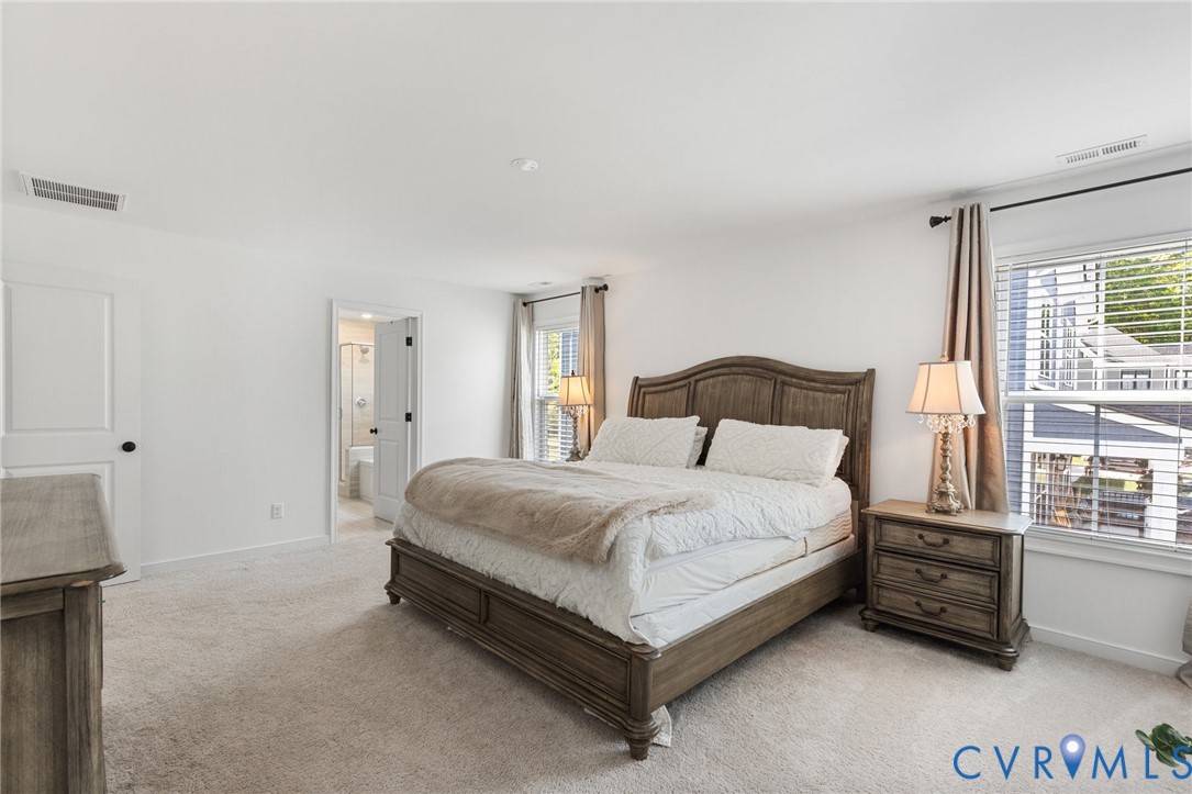 10001 Craftsbury Drive Midlothian, VA 23112 - Photo 20 of 32 a bedroom with a bed and a window