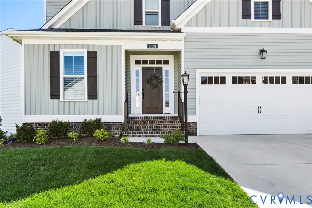10001 Craftsbury Drive Midlothian, VA 23112 - Photo 2 of 32 front view of a house with a yard