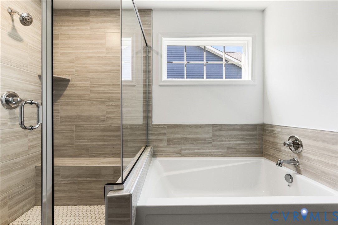 10001 Craftsbury Drive Midlothian, VA 23112 - Photo 23 of 32 a bathroom with bathtub and shower