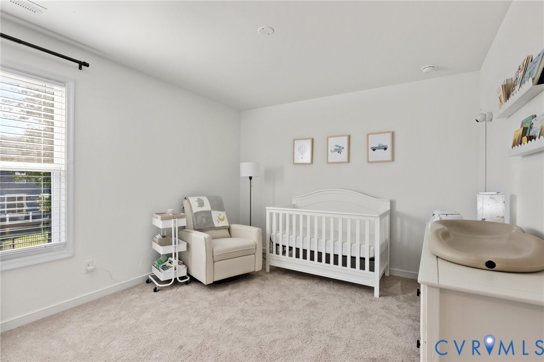 10001 Craftsbury Drive Midlothian, VA 23112 - Photo 25 of 32 a bedroom with a bed and a window