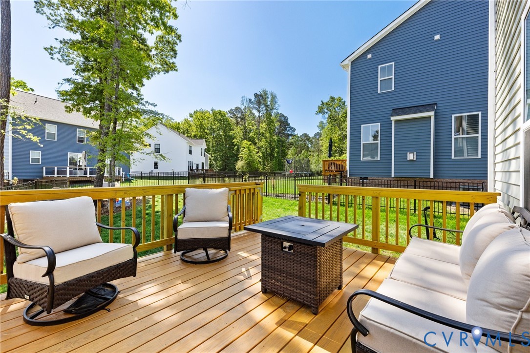 10001 Craftsbury Drive Midlothian, VA 23112 - Photo 29 of 32 a view of a swimming pool with couches and lounge chairs