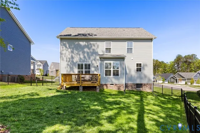 a front view of a house with a yard table and chairs