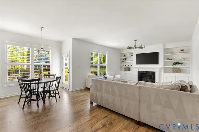 a view of a livingroom with furniture window and wooden floor