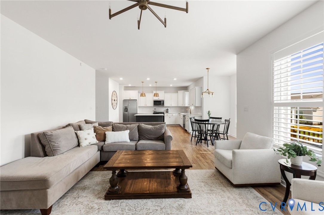 10001 Craftsbury Drive Midlothian, VA 23112 - Photo 9 of 32 a living room with furniture and a large window
