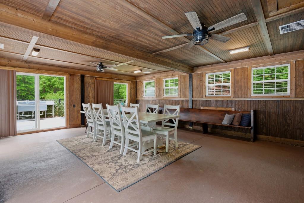 582 Knox Chapel Road Social Circle, GA 30025 - Photo 38 of 49 a dining room with furniture a rug and a large window