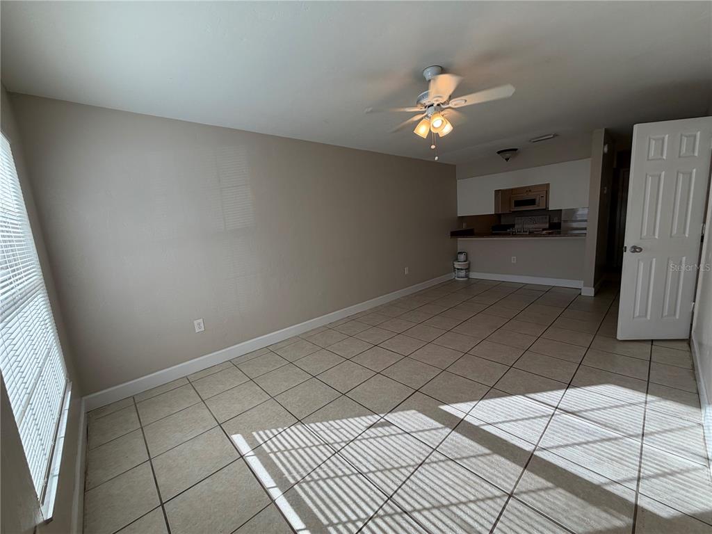 1718 Southwest 69th Terrace, Unit C Gainesville, FL 32607 - Photo 11 of 14 a view of a kitchen with a sink and a refrigerator