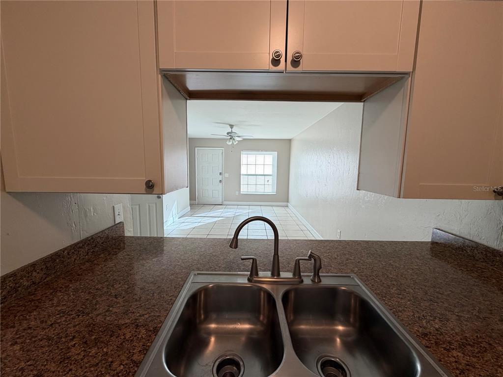 1718 Southwest 69th Terrace, Unit C Gainesville, FL 32607 - Photo 9 of 14 a close view of a sink and dishwasher in the kitchen