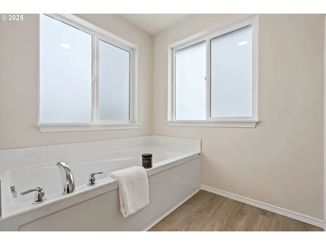 a bathroom with a bathtub and a sink