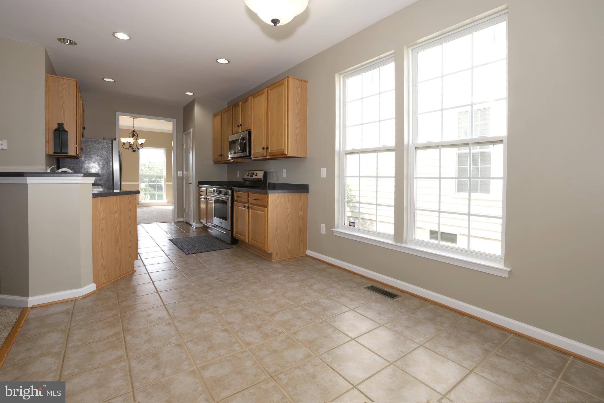 14205 Reidhall Place Gainesville, VA 20155 - Photo 16 of 54 View #2 Kitchen eat in area - huge windows!