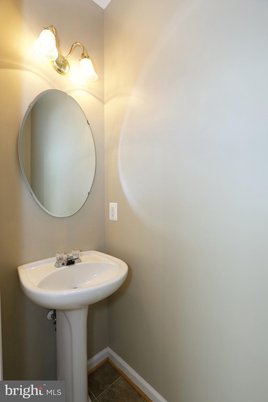 14205 Reidhall Place Gainesville, VA 20155 - Photo 20 of 54 Powder room off hall and foyer