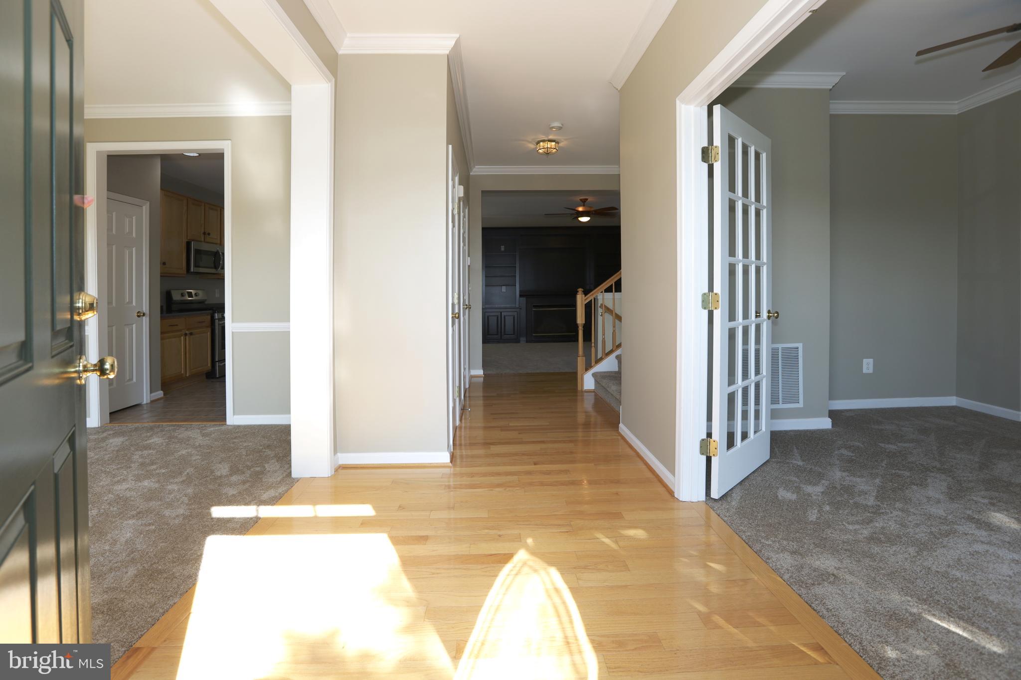 14205 Reidhall Place Gainesville, VA 20155 - Photo 4 of 54 The front entrance - Hardwood Floors