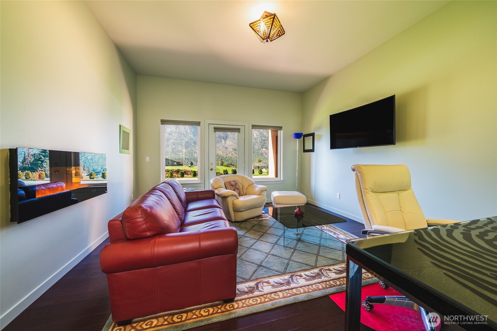 555 Loop Avenue Manson, WA 98831 - Photo 15 of 33 a living room with furniture and a flat screen tv