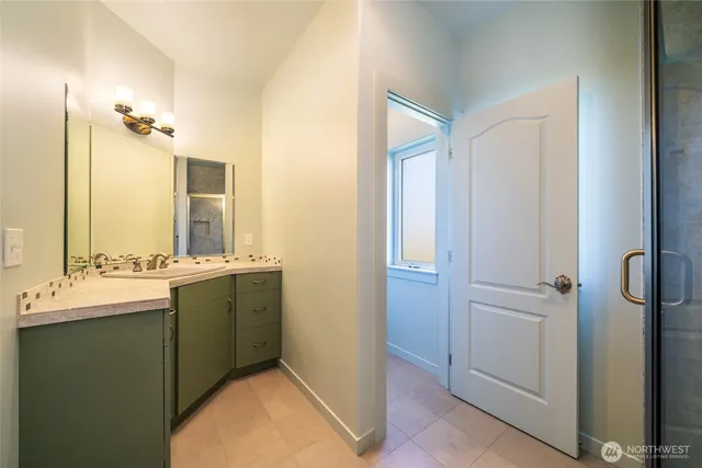 a bathroom with a double vanity sink and mirror