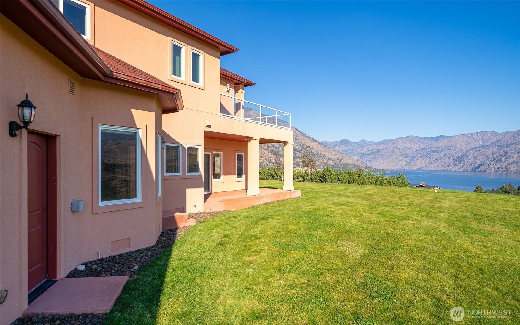 555 Loop Avenue Manson, WA 98831 - Photo 28 of 33 a front view of a house with a yard