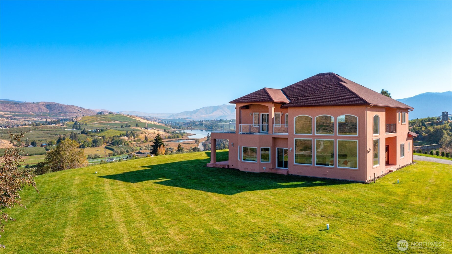 555 Loop Avenue Manson, WA 98831 - Photo 30 of 33 a view of a house with a garden and swimming pool