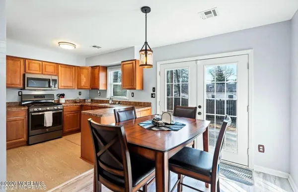 a view of a dining room with furniture window and outside view