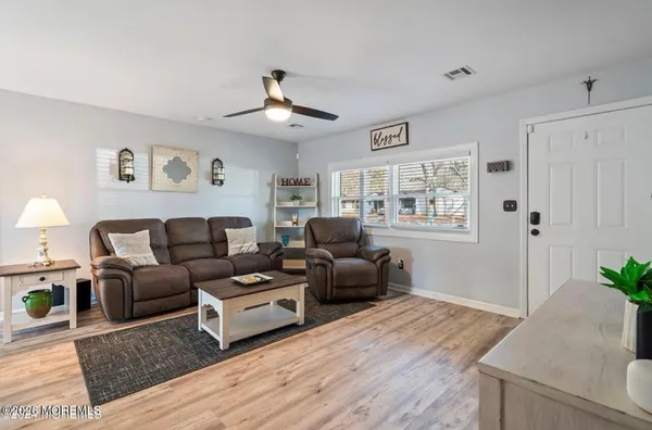 a living room with furniture and a window