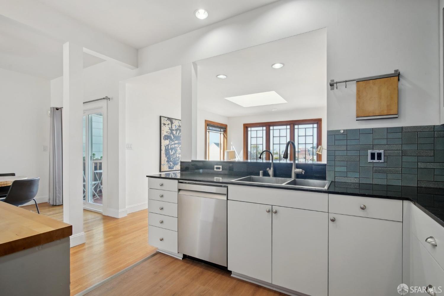 20 Wright Street San Francisco, CA 94110 - Photo 11 of 34 a spacious bathroom with double sink and a large mirror